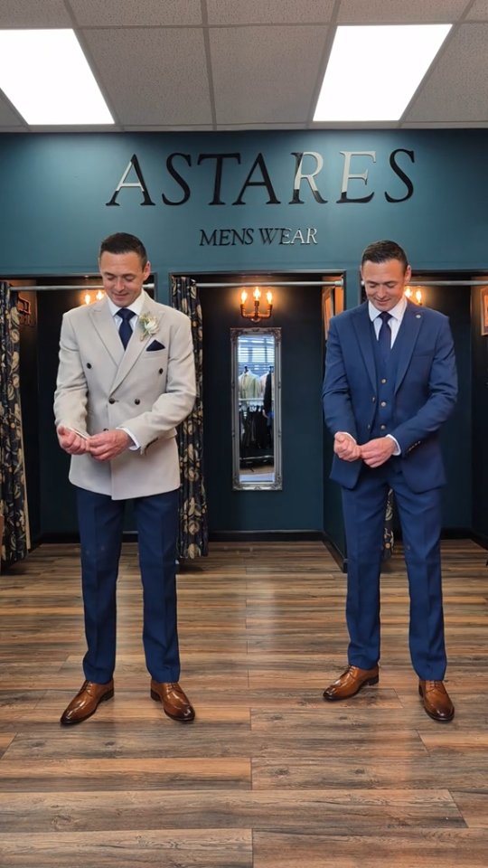 Two men in tailored suits wearing polished brown dress shoes