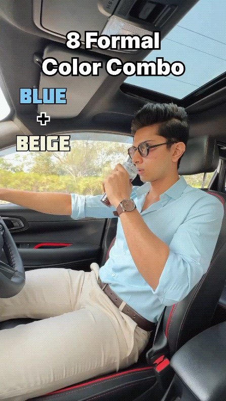 Man wearing a light blue shirt with beige trousers and brown leather accessories