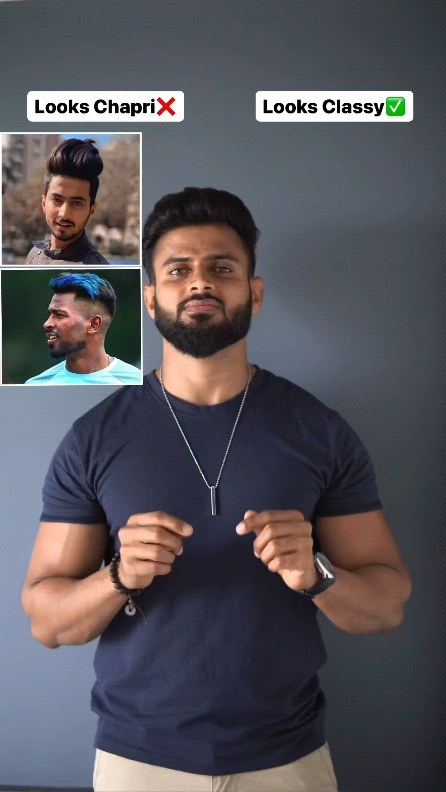 Well-groomed man with neat dark hair, lined beard and simple dark T-shirt