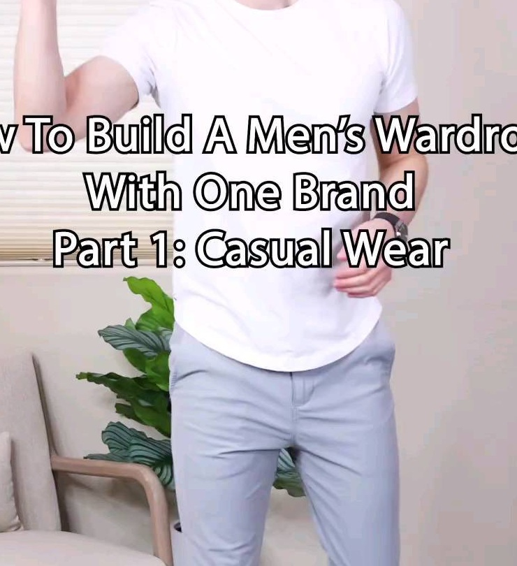 Torso view showing a white T-shirt paired with clean light-grey trousers in a low-contrast casual outfit