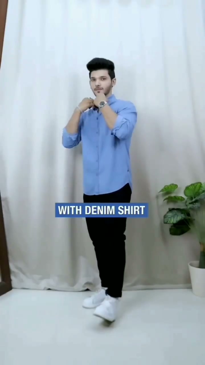 Light blue denim shirt with black jeans and white sneakers