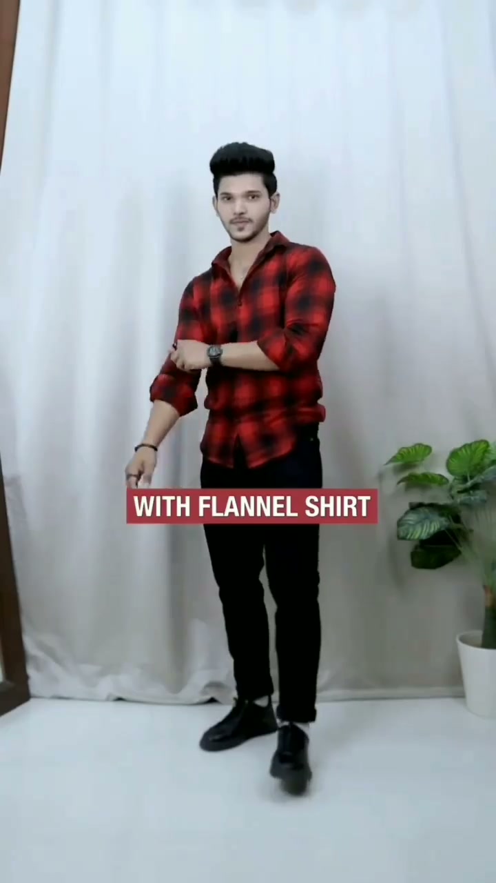 Red and black flannel shirt with black jeans and black casual shoes