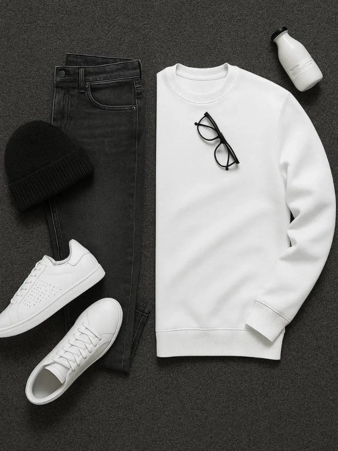 White sweatshirt, black jeans, black beanie and white sneakers flat lay