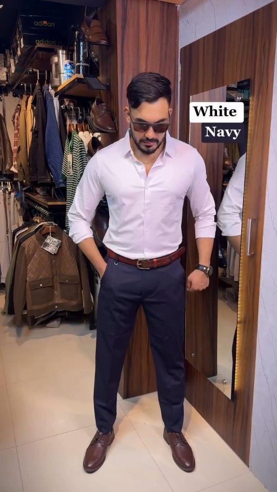 Men wearing a light shirt with navy trousers, brown leather shoes and a matching brown belt